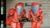 FILE - Tokyo Fire Department special rescue unit members wearing anti-NBC (Nuclear, Biological, and Chemical weapons) suits participate in an anti-terrorism drill in Japan, May 11, 2016.