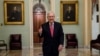 Senate Majority Leader Mitch McConnell of Ky. gives a thumbs up as he arrives on Capitol Hill, March 25, 2020, in Washington. 