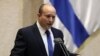 Israel's new prime minister, Naftali Bennett, speaks during a Knesset session in Jerusalem, June 13, 2021.