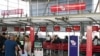 Travelers wait in line at a Virgin Australia Airlines counter at Kingsford Smith International Airport, amid the coronavirus outbreak, in Sydney, Australia, March 18, 2020.