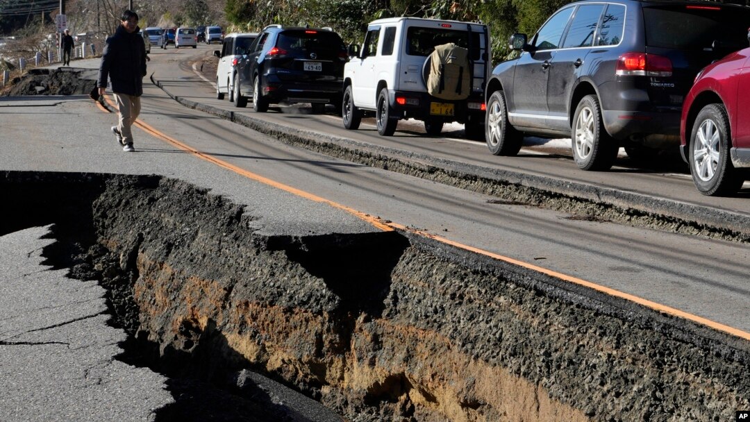 A traffic jam is seen on a partially collapsed road caused by powerful earthquake near Anamizu Town, Ishikawa Prefecture Tuesday, Jan. 2, 2024.