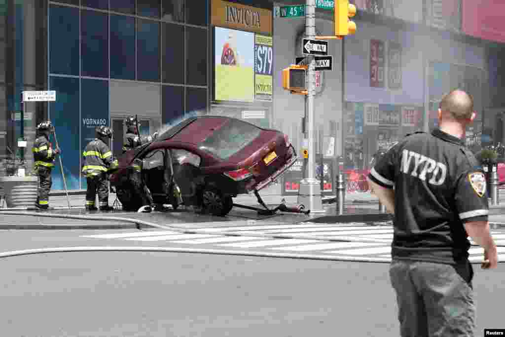 A vehicle that struck pedestrians in Times Square crashes on the sidewalk in New York City, killing one person and injuring more than 20 pedestrians.