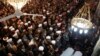 People and officials attend funeral prayers for a senior pro-Syrian government Muslim cleric Mohammed al-Buti and his grandson Ahmad al-Buti, killed in a mosque explosion on Thursday, at Umayyad Mosque in Damascus, March 23, 2013. 