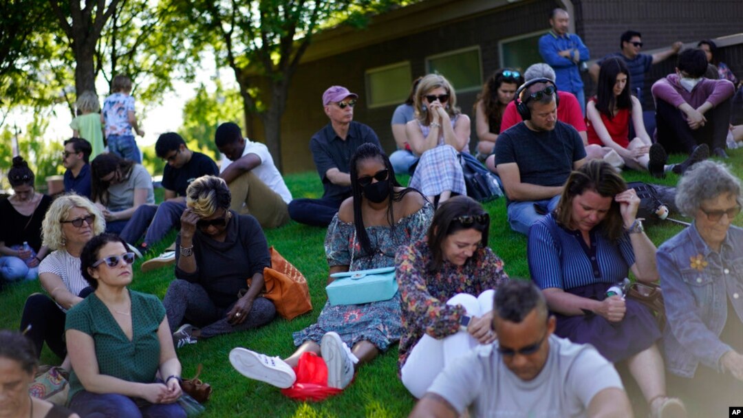 People pray at a memorial for the lives lost during centennial commemorations of the Tulsa Race Massacre, May 28, 2021, in Tulsa, Okla. 