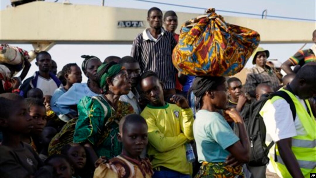 In this image taken May 23, 2015, refugees who fled Burundi's violence and political tension arrive in Kigoma, Tanzania, after making the journey on Lake Tanganyika. 