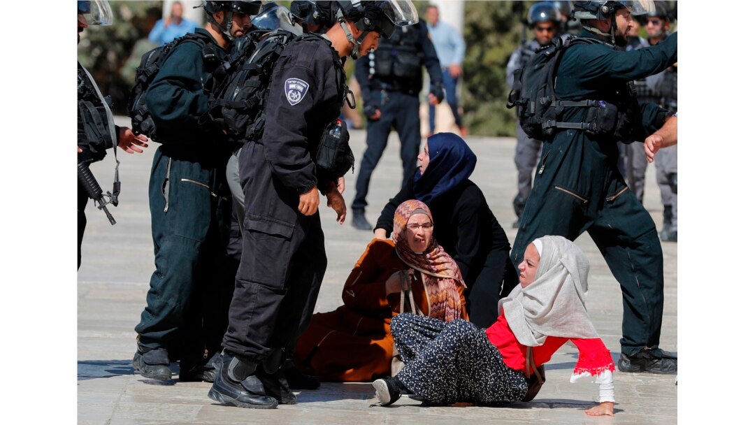 Israeli security forces scuffle with Palestinians at the al-Aqsa Mosque compound in the Old City of Jerusalem on Aug. 11, 2019.