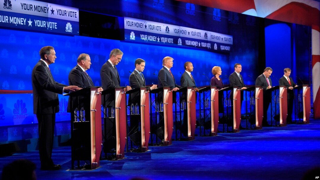 Republican presidential candidates, from left, John Kasich, Mike Huckabee, Jeb Bush, Marco Rubio, Donald Trump, Ben Carson, Carly Fiorina, Ted Cruz, Chris Christie and Rand Paul take the stage during the CNBC Republican presidential debate at the University of Colorado, Oct. 28, 2015.