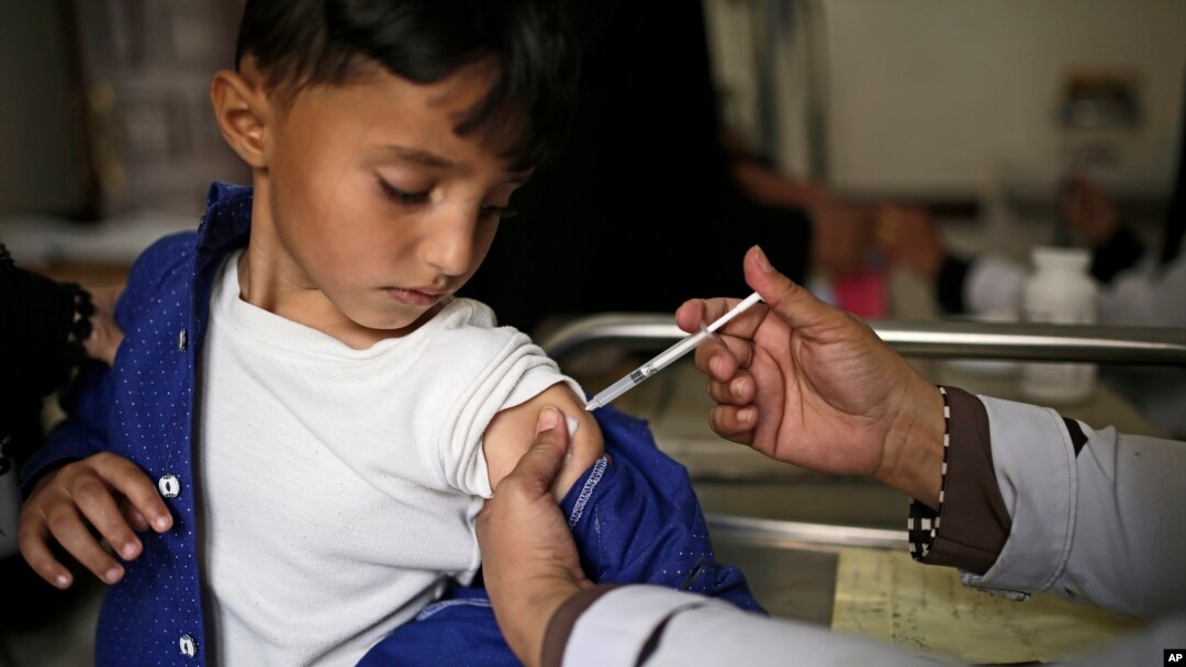 FILE - A boy receives a diphtheria vaccine at a hospital in Sanaa, Yemen, Sept. 9, 2019.