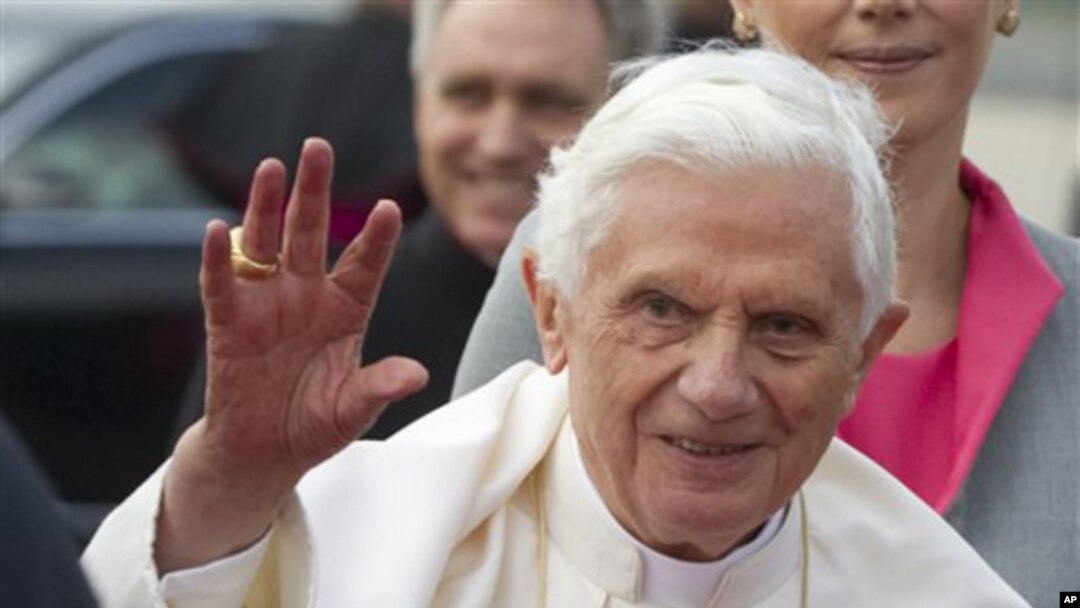 Pope Benedict XVI waves after his arrival at Tegel airport in Berlin, Germany, Thursday, Sept. 22, 2011.