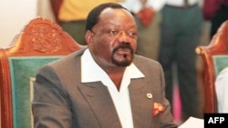 FILE - Angolan Jonas Savimbi holds a joint statement at the media conference in Umtata in the Eastern Cape, Jan. 8, 1997. 