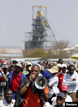 A mineworker addresses his colleagues before taking part in a march outside the Anglo American mine in South Africa's North West Province, September 12, 2012.