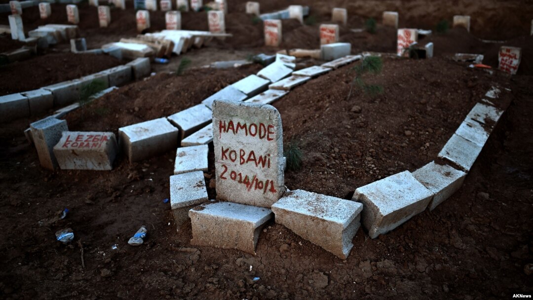 Graves of Kurdish people killed fighting alongside People's Protection Units (YPG) against Islamic State (IS) jihadists for the control of the mainly-Kurdish Syrian town of Kobani, also known as Ain al-Arab, in the cemetery of the Turkish town of Suruc, Oct. 15, 2014. 