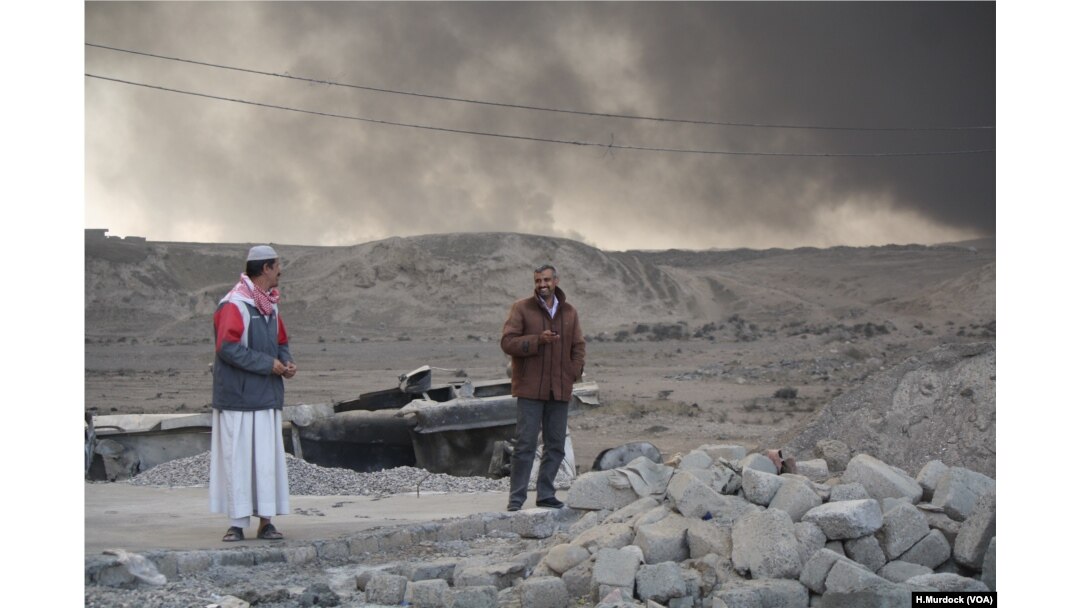 On the outskirts of Qayyarah, Iraq locals say oil fires left behind have raged almost unchecked for months, Nov. 5, 2016.