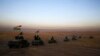 A peshmerga convoy drives toward a frontline in Khazer, about 30 kilometers east of Mosul, Iraq, Oct. 17, 2016. The Iraqi military and the country's Kurdish forces launched operations to the south and east of militant-held Mosul early Monday morning. 