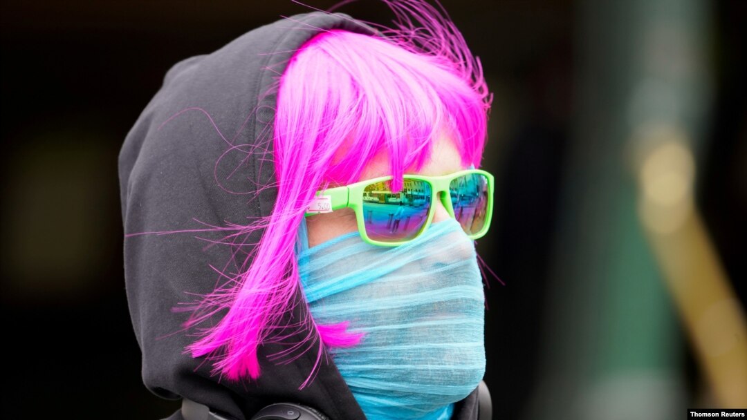 A person wears a scarf as a protective face mask in Melbourne after it became the first city in Australia to enforce mask-wearing in public as part of efforts to curb a resurgence of the coronavirus disease (COVID-19), July 23, 2020.