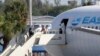 Passengers from virus-stricken cruise ships begin to depart