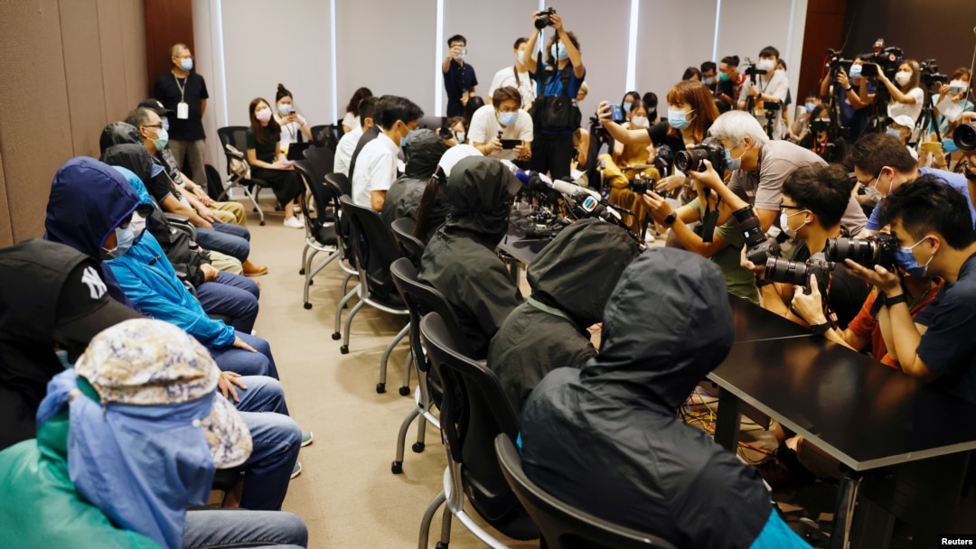 FILE - Family members of twelve Hong Kong activists, detained as they reportedly sailed to Taiwan for political asylum, hold a news conference to seek help in Hong Kong, Sept. 12, 2020.