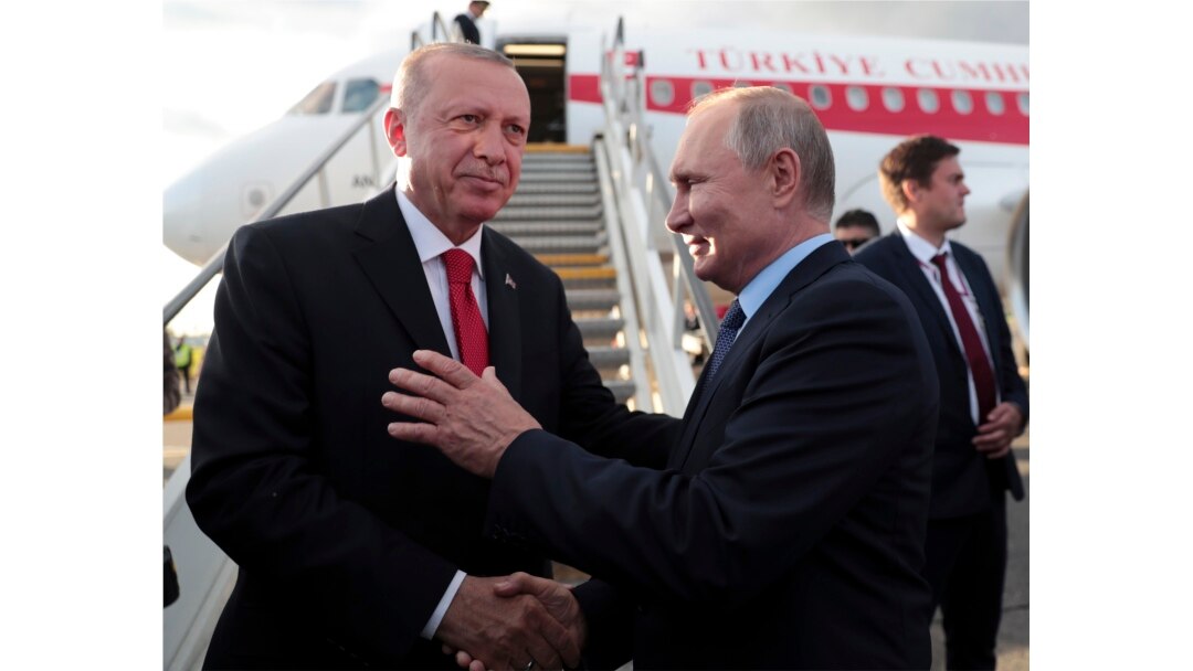 FILE - Russia's President Vladimir Putin, right, shakes hands with Turkey's President Recep Tayyip Erdogan before his departure from Zhukovsky, outside Moscow, Aug. 27, 2019.