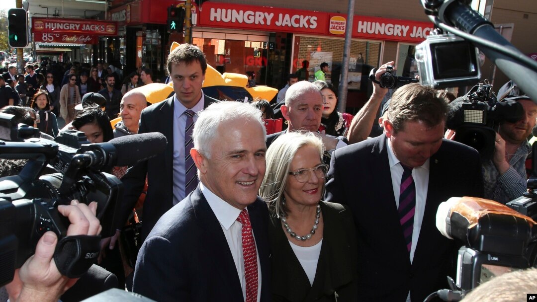 Prime Minister Malcolm Turnbull greets people during a walk through a shopping street in Burwood, Sydney, Australia, Friday, July 1, 2016. 