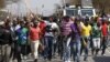 Mineworkers take part in a march outside the Anglo American mine in South Africa's North West Province, September 12, 2012. 