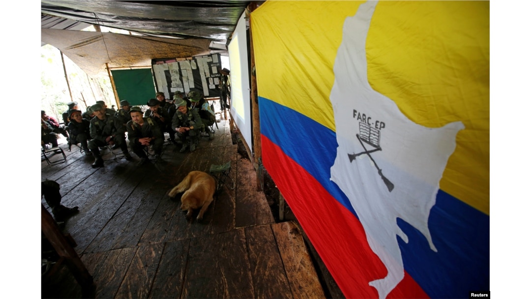 Members of the 51st Front of the Revolutionary Armed Forces of Colombia (FARC) listen to a lecture on the peace process between the Colombian government and their force at a camp in Cordillera Oriental, Colombia, Aug. 16, 2016.