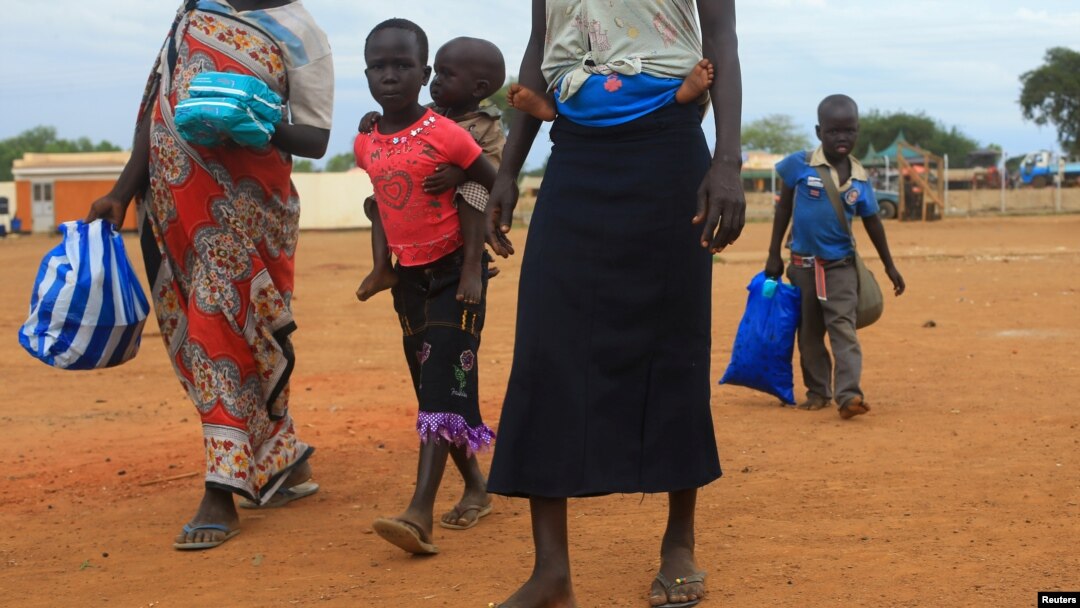FILE - A South Sudan refugee family arrives at a refugee reception point at Elegu, within Amuru district of the northern region near the South Sudan-Uganda border, Aug. 20, 2016.