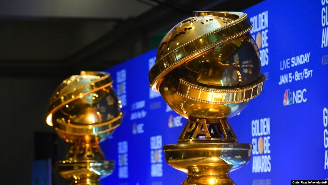 FILE - Replicas of Golden Globe statues are seen at the nominations for the 77th annual Golden Globe Awards in Beverly Hills, Calif., Dec. 9, 2019.