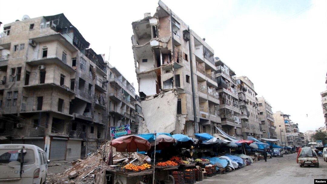 FILE - Stalls are seen on a street beside damaged buildings in the rebel held al-Shaar neighborhood of Aleppo, Syria, Feb. 10, 2016. 