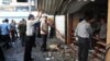 In this photo released by the Syrian official news agency SANA, Syrians inspect a damaged shop at a scene of two explosions in the central district of al-Marjeh, Damascus, Syria, June 11, 2013.