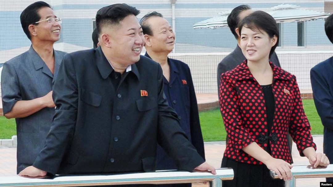 North Korean leader Kim Jong Un and a woman being identified by state TV as his wife 'Comrade Ri Sol Chu,' visit the Rungna People's Pleasure Ground, which is nearing completion, in Pyongyang, July 25, 2012.