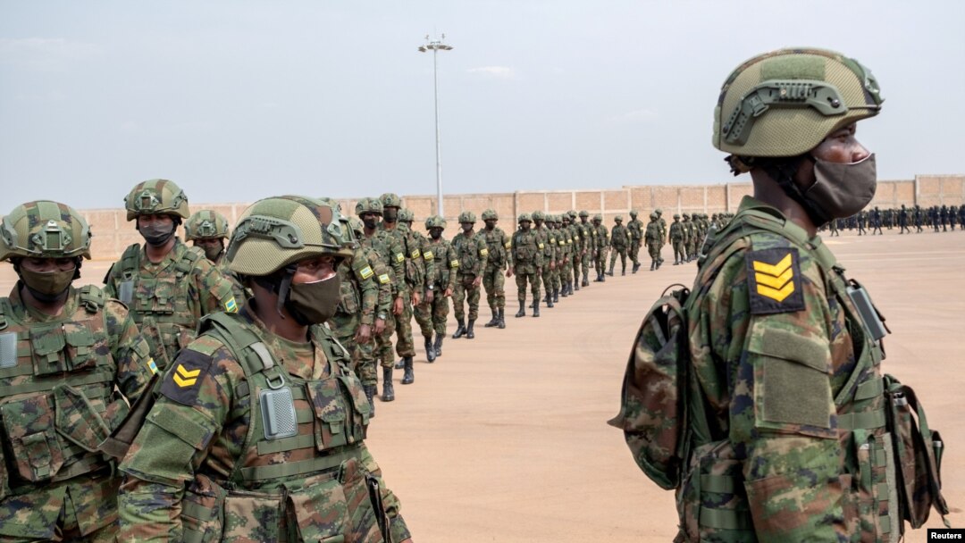FILE - Rwandan military troops depart for Mozambique to help the country combat an escalating Islamic State-linked insurgency that threatens its stability, at the Kigali International Airport in Kigali, Rwanda July 10, 2021.