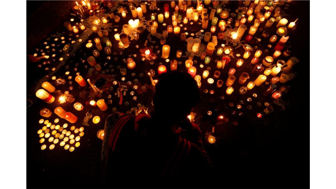 FILE - People visit a memorial for victims of a shooting at the Masjid Al Noor mosque in Christchurch, New Zealand, March 18, 2019.