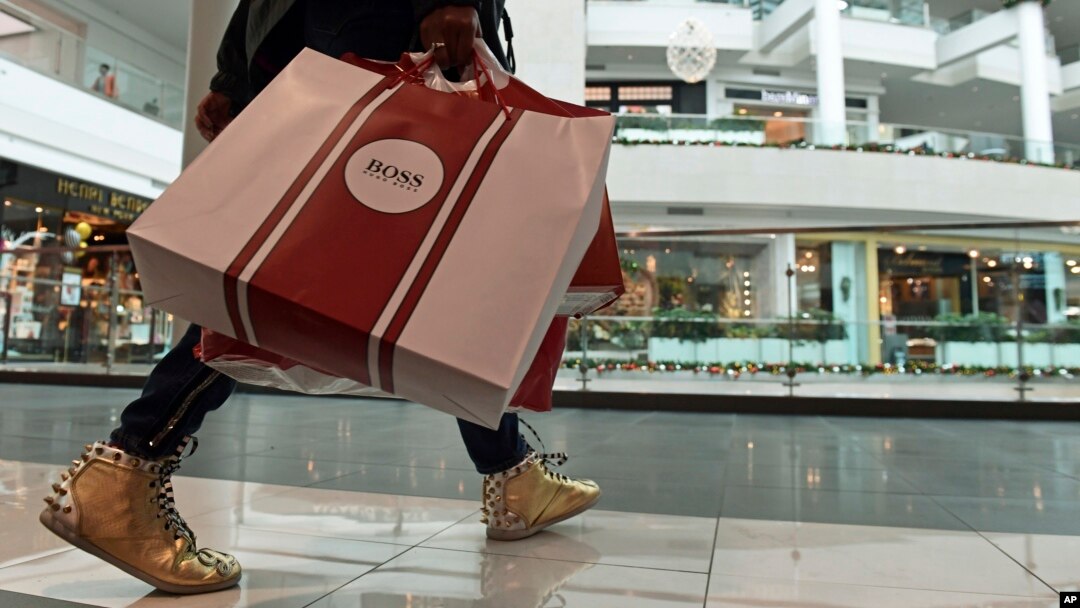 FILE - A shopper is seen at the Pentagon City Mall in Arlington, Virginia, Dec. 22, 2017. On March 1, 2018, the U.S. Commerce Department issued its January report on consumer spending.