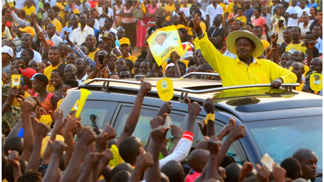 FILE - Uganda's President Yoweri Museveni of the ruling party National Resistance Movement waves to his supporters in Entebbe, Uganda, Feb. 10, 2016.
