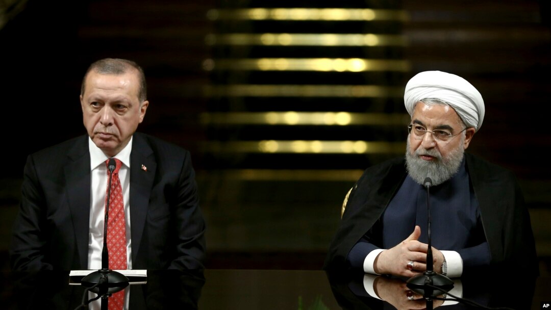 Iranian President Hassan Rouhani (R) speaks with media during a joint press conference with Turkish President Recep Tayyip Erdogan after their meeting at the Saadabad Palace in Tehran, Iran, Oct. 4, 2017.