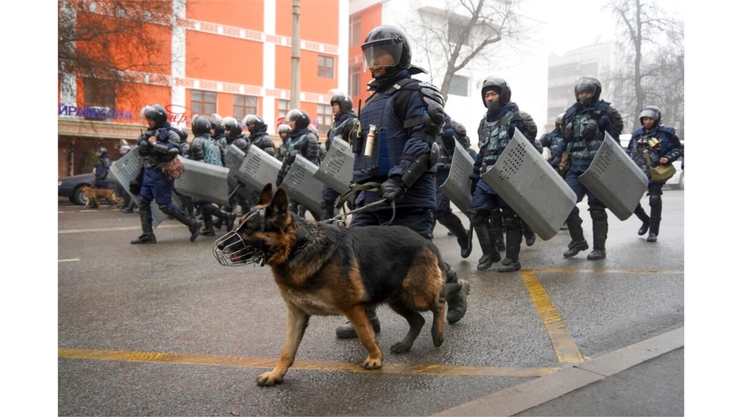 FILE - Riot police walk to block demonstrators gathering during a protest in Almaty, Kazakhstan, Jan. 5, 2022.