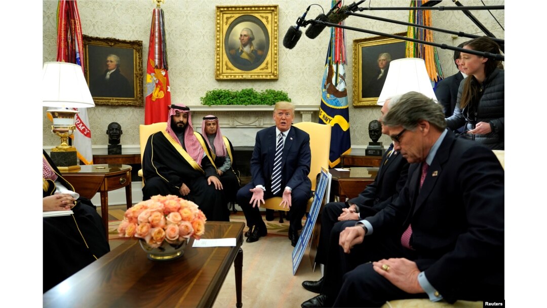 U.S. President Donald Trump, flanked by Energy Secretary Rick Perry, delivers remarks as he welcomes Saudi Arabia's Crown Prince Mohammed bin Salman in the Oval Office at the White House in Washington, March 20, 2018.