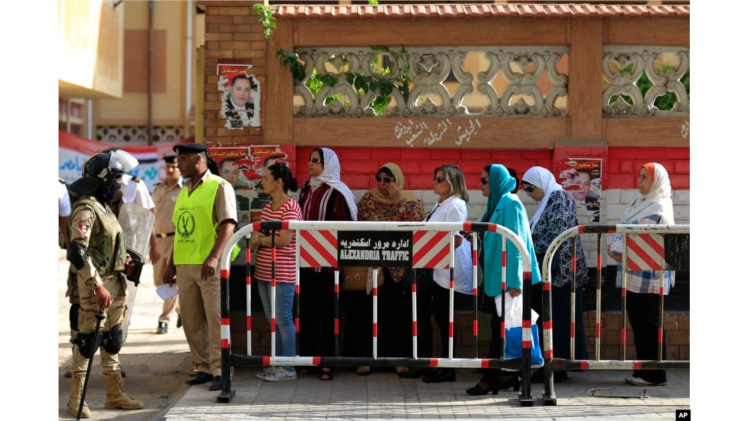FILE - Egyptians wait to cast their votes outside a polling station during the Egyptian parliamentary election in Alexandria, Egypt, Oct. 18, 2015.