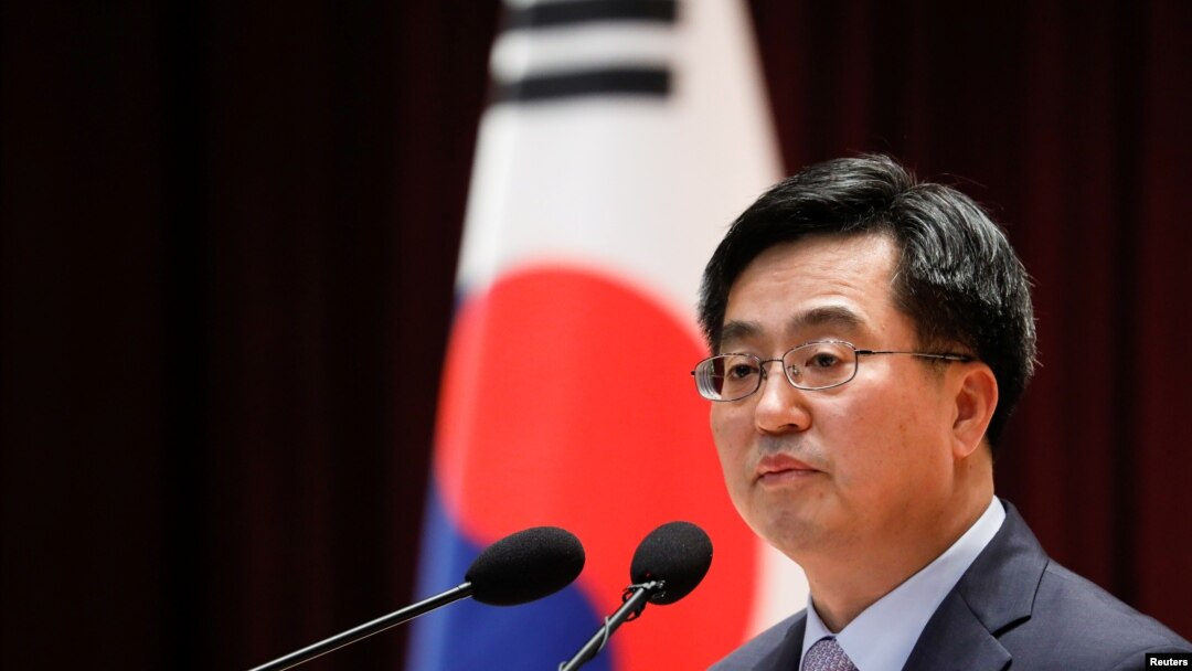 FILE - South Korean Finance Minister Kim Dong-yeon speaks during his inaugural ceremony in Sejong government complex in Sejong, South Korea, June 15, 2017. 