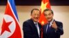 N. Korean Foreign Minister Ri Yong Ho, left, is greeted by his Chinese counterpart Wang Yi prior to their bilateral meeting on the sidelines of the 50th ASEAN Foreign Ministers' Meeting and its Dialogue Partners, Aug. 6, 2017. 