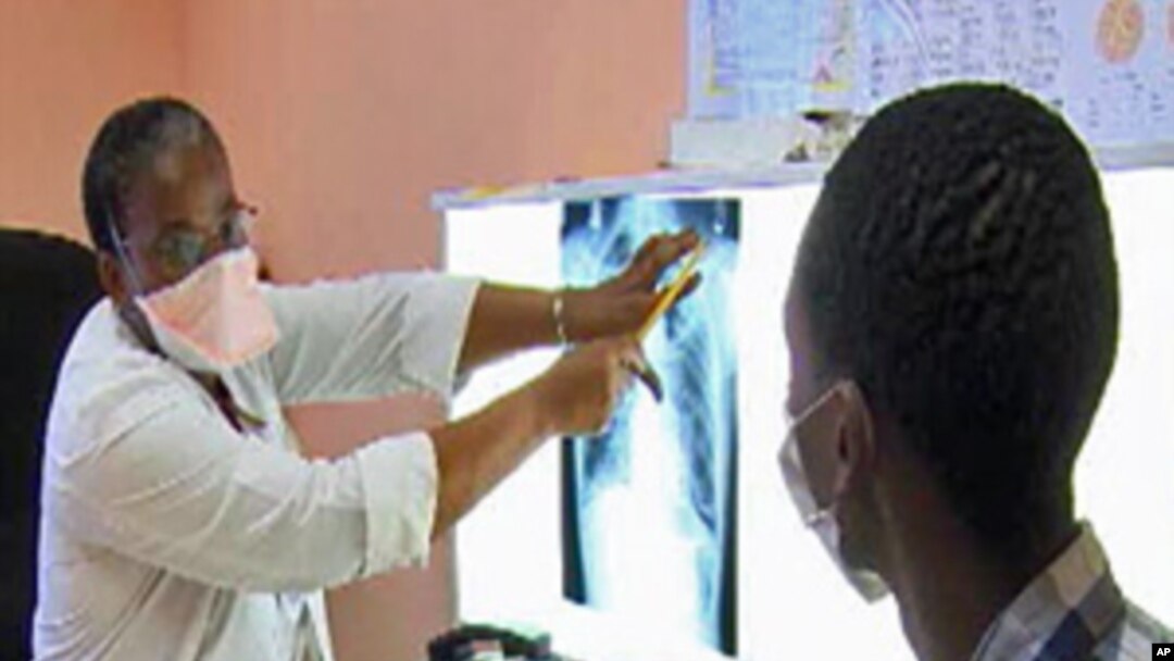 A South African tuberculosis patient with his physician