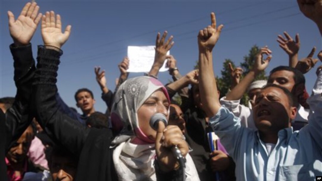 Yemeni students chant slogans calling on their president Ali Abdullah Saleh to leave the government and follow Tunisian ousted President Zine El Abidine Ben Ali into exile during a protest in Sanaa, Yemen, 22 Jan 2011