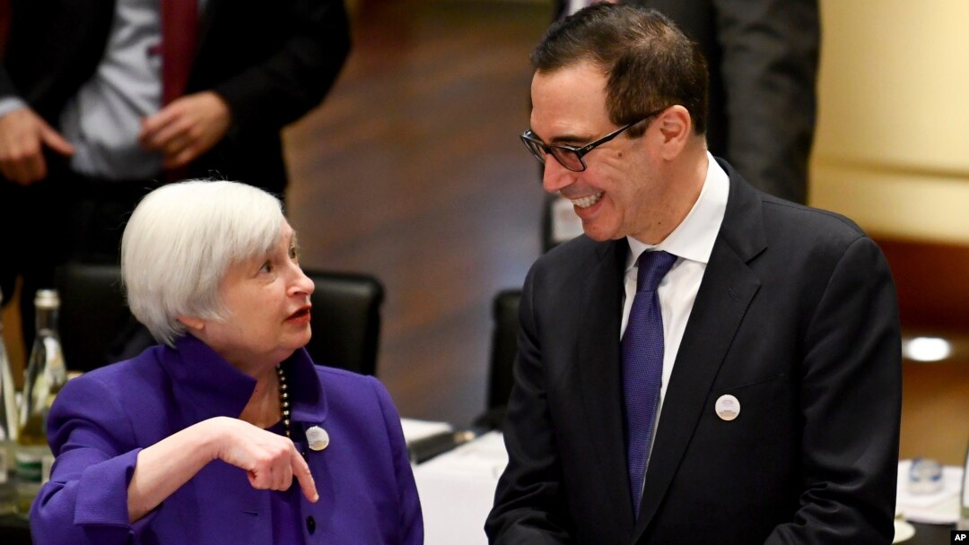 Janet Yellen, president of the Federal Reserve Board, and U.S. Treasury Secretary Steven Mnuchin talk to each other during the G20 finance ministers meeting in Baden-Baden, Germany, March 17, 2017.