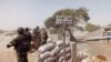 FILE - Cameroon soldiers stand guard at a lookout post as they take part in operations against the Islamic extremists group Boko Haram.