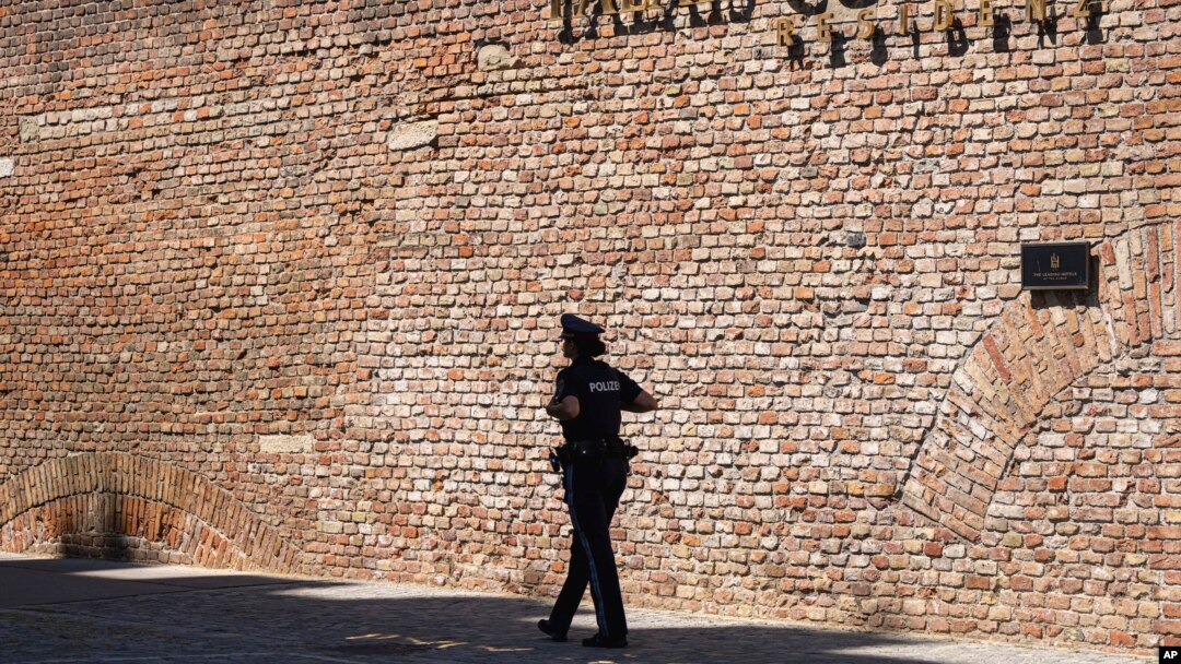  A police officer walkes in front of the Palais Coburg where closed-door nuclear talks take place in Vienna, Austria, Aug. 5, 2022.