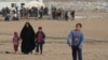 Camp officials say IS families continue to arrive at the Haj Ali camp daily fearing retribution attacks, keeping the camp filled despite the fact that many families that fled IS are going home, Dec. 27, 2017. 