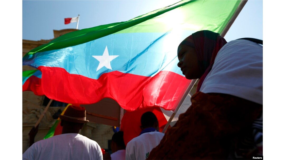 FILE - Members of the Oromo community of Ethiopia, living in Malta, protest against the Ethiopian regime and its plan to displace Oromo farmers outside the office of Malta's Prime Minister in Valletta, June 16, 2014.