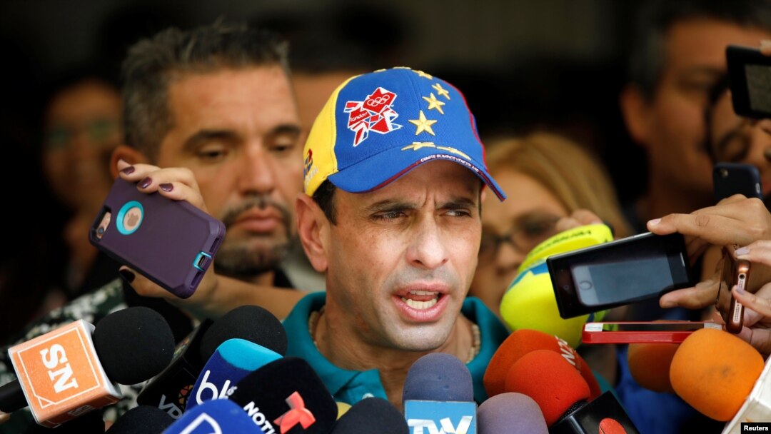 FILE - Venezuela's opposition leader Henrique Capriles speaks to the media in Caracas, Oct. 15, 2017. 