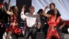 South Africa's Minister of Health, Aaron Motsoaledi (C), dances during the launch of a major HIV counseling and testing campaign at Katlehong township outside Johannesburg, April 25, 2010.