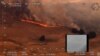 An aerial view of a bushfire in Ellerslie, New South Wales, Australia December 30, 2019 in this still image obtained from social media video. NSW RURAL FIRE SERVICE/via REUTERS THIS IMAGE HAS BEEN SUPPLIED BY A THIRD PARTY. MANDATORY CREDIT. NO…